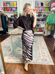 Brown and white zebra-print midi pencil skirt with fitted silhouette and side slit