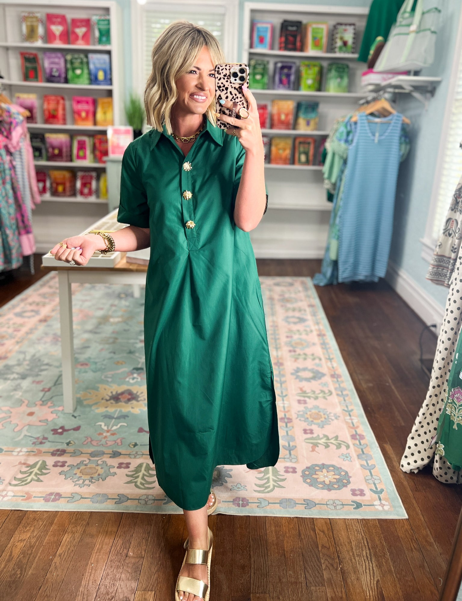 Hunter green midi shirt dress with collared neckline, short sleeves, and gold button accents