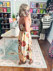 Floral midi dress from the back, sleeveless with wide shoulder straps and gathered fit