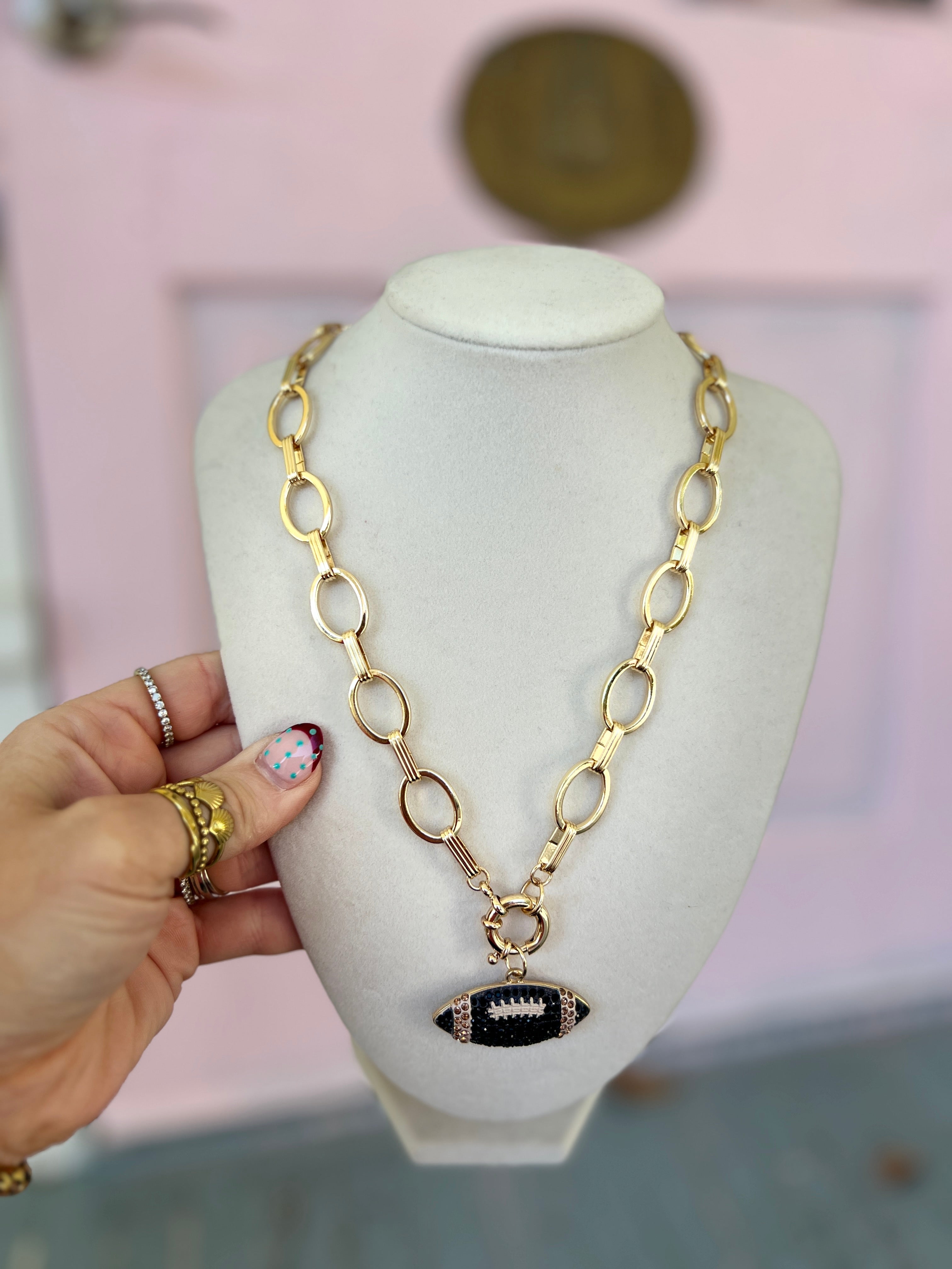 Gold chain necklace with black crystal pendant