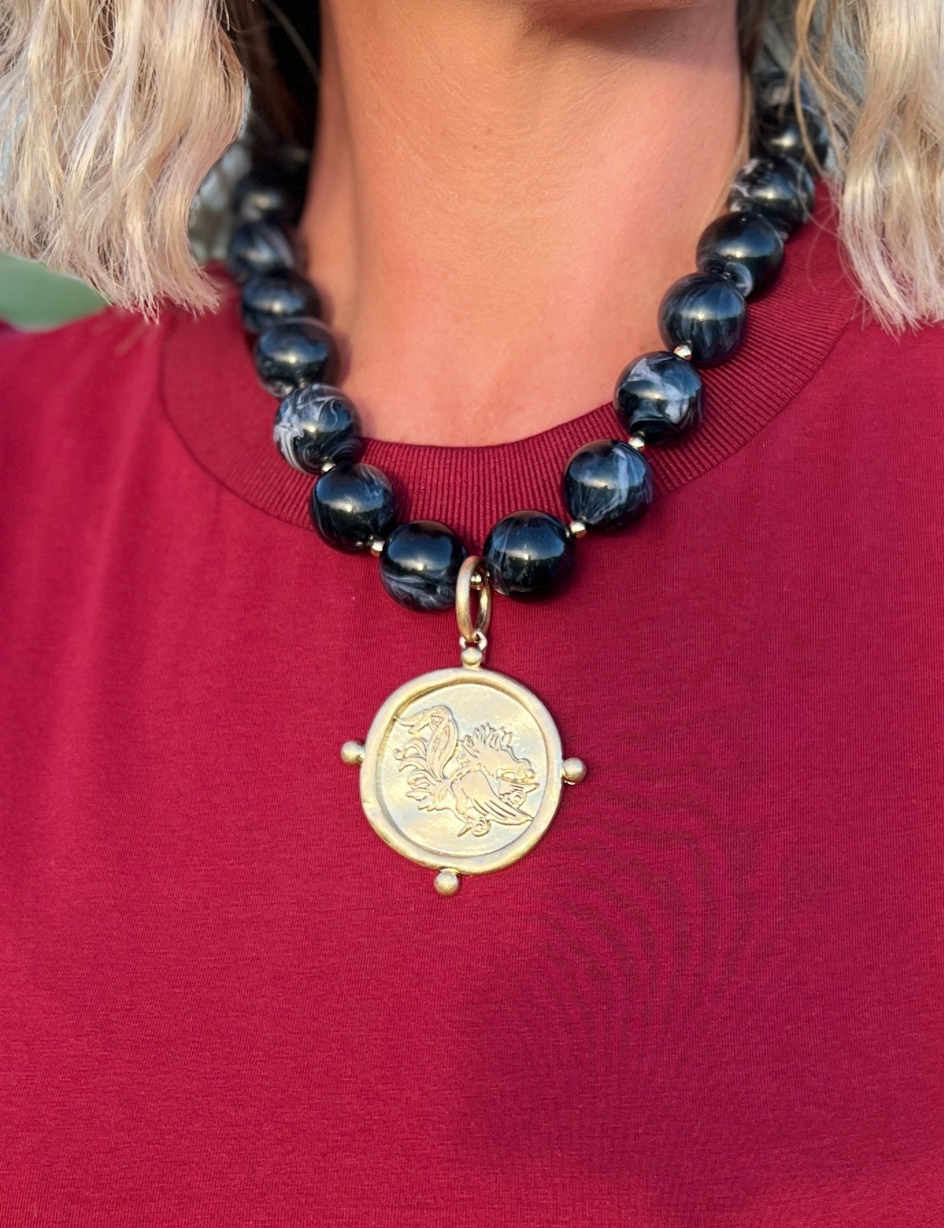 Black acrylic marble bead necklace with Gamecock medallion pendant and gold clasp