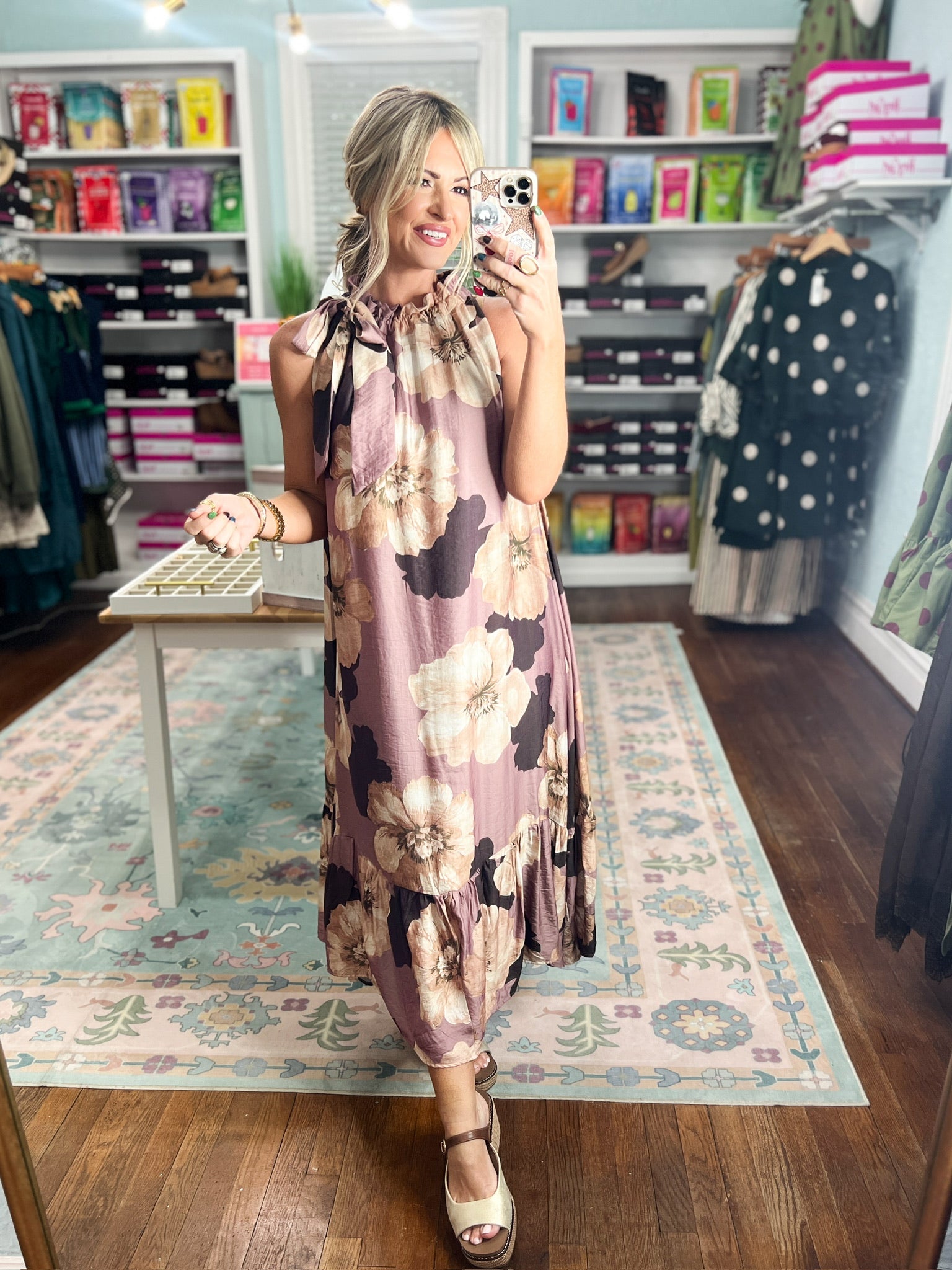 Sleeveless mauve midi dress with bold floral print, ruffled neckline and tiered skirt