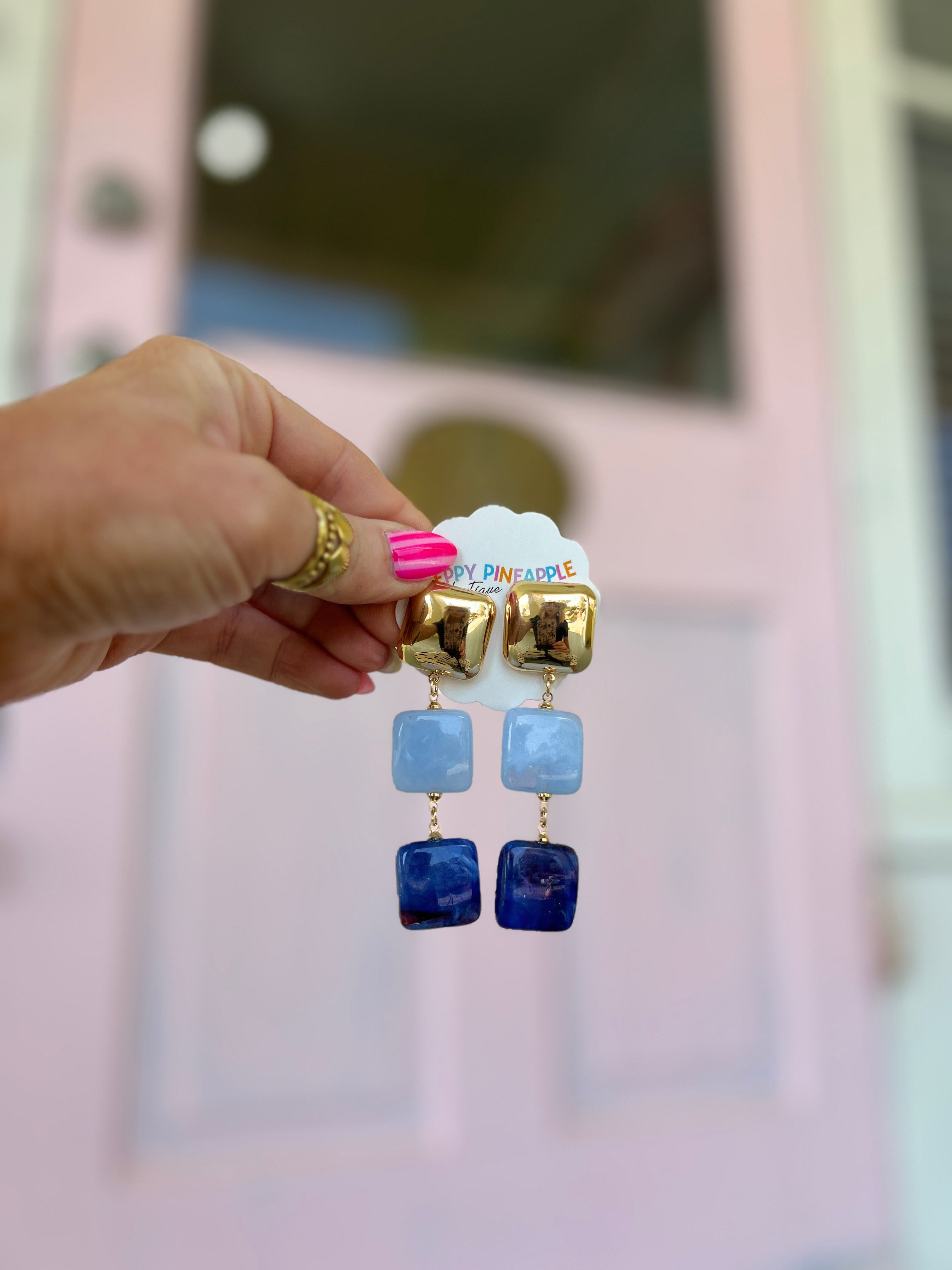 Gold-tone linear earrings with blue square acrylic drop charms