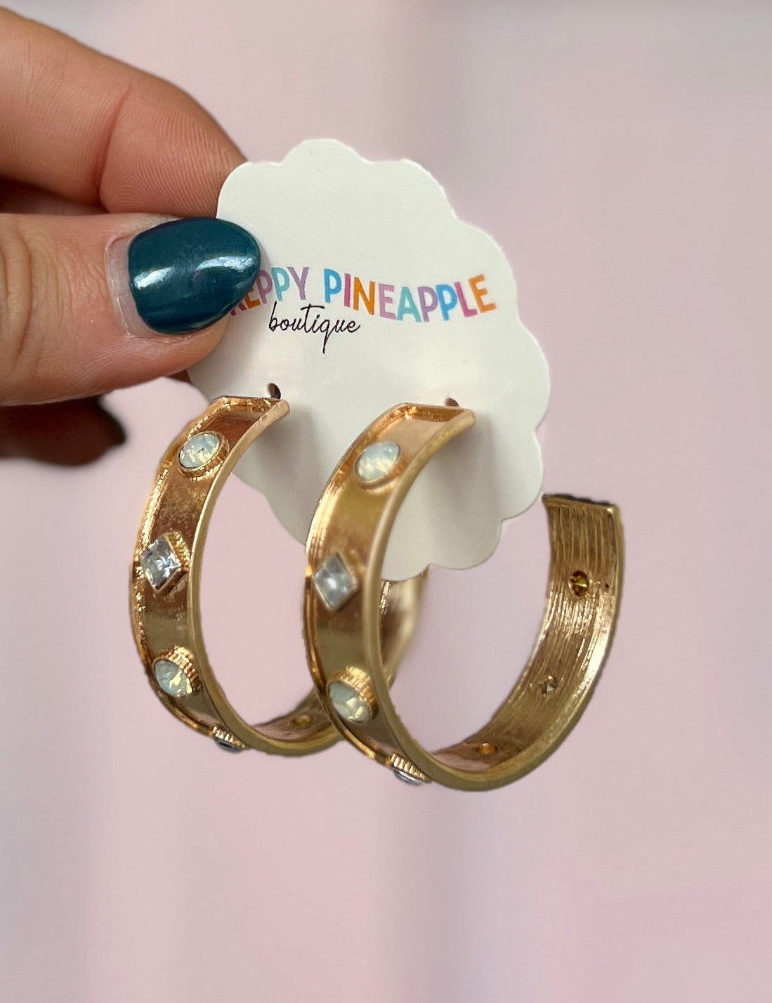 Gold-tone stone station hoop earrings with round and square clear gems