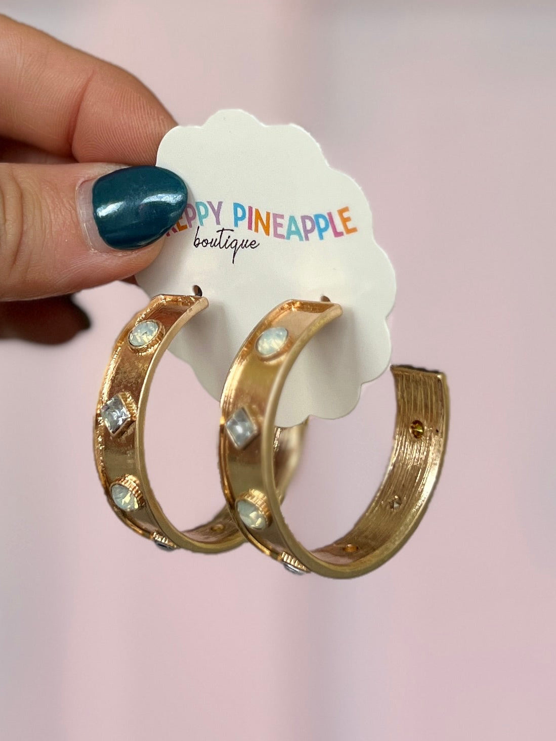 Gold-tone stone station hoop earrings with round and square clear gems