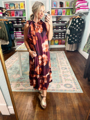 Sleeveless midi dress in deep burgundy with large floral print and bow tie neckline