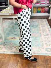 Off-white wide-leg denim pants with black polka dots, side view