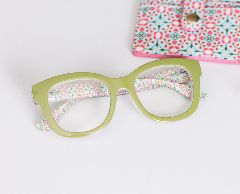 Green eyeglass frames with multicolor patterned inner arms, white lenses