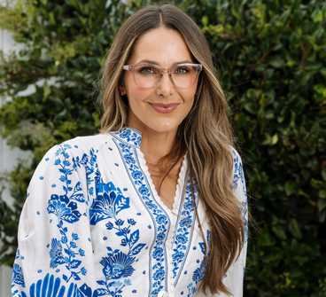 Eyeglasses on model: light gray frames with patterned temple arms
