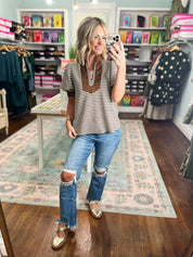 Striped short sleeve V-neck top with brown neckline trim, casual worn look