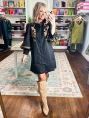 Black long-sleeve mini dress with gold leopard embroidery and scalloped cuffs