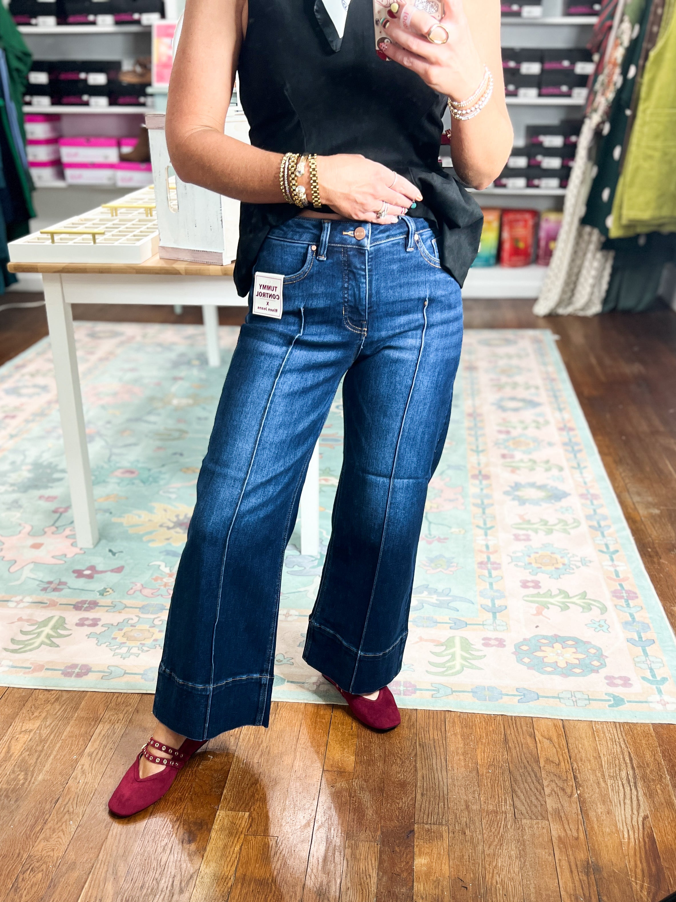 Deep blue mid-rise crop wide-leg jeans with pintuck front and button closure