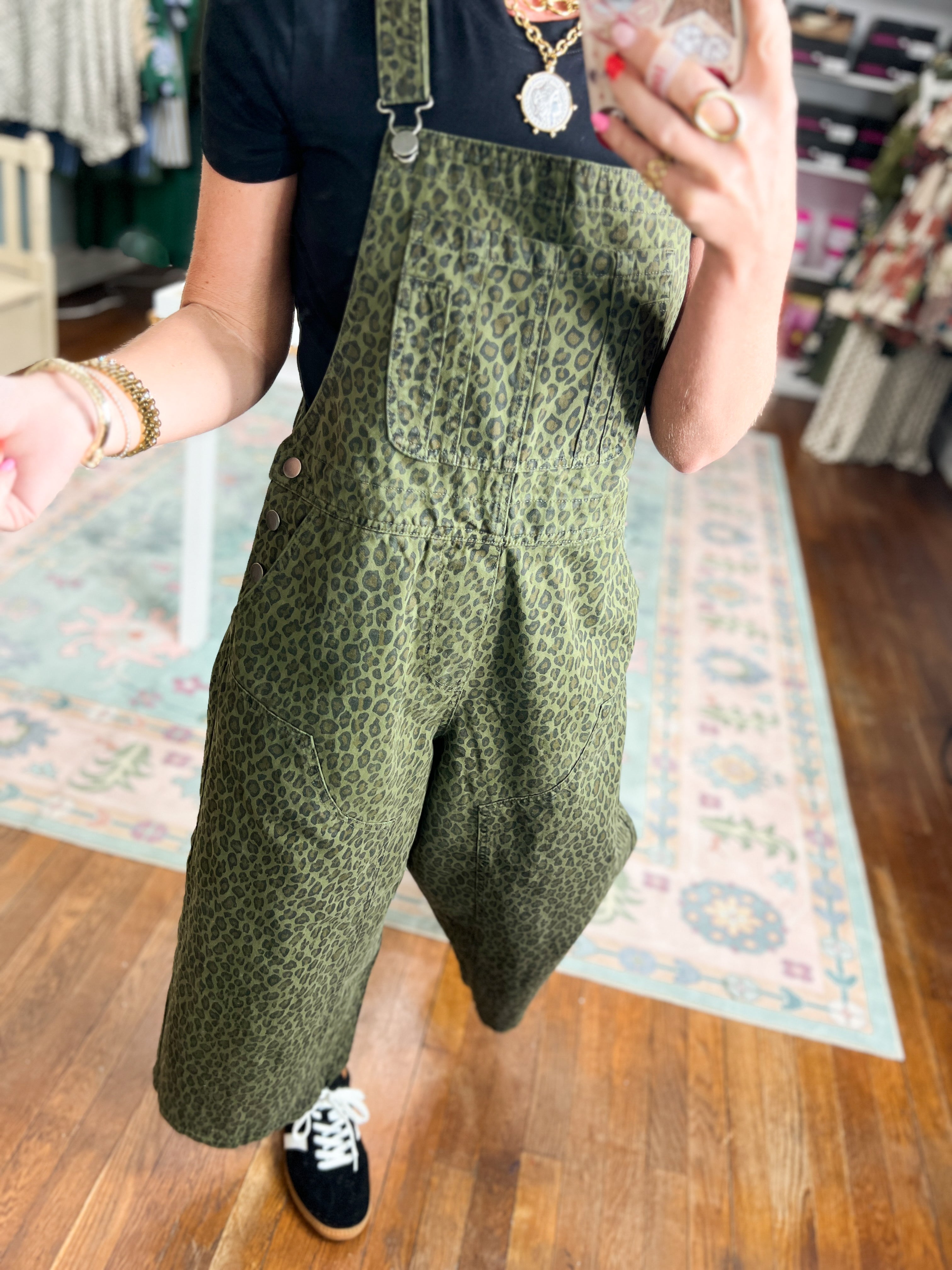 Olive patterned twill overalls with bib front and relaxed wide-leg fit