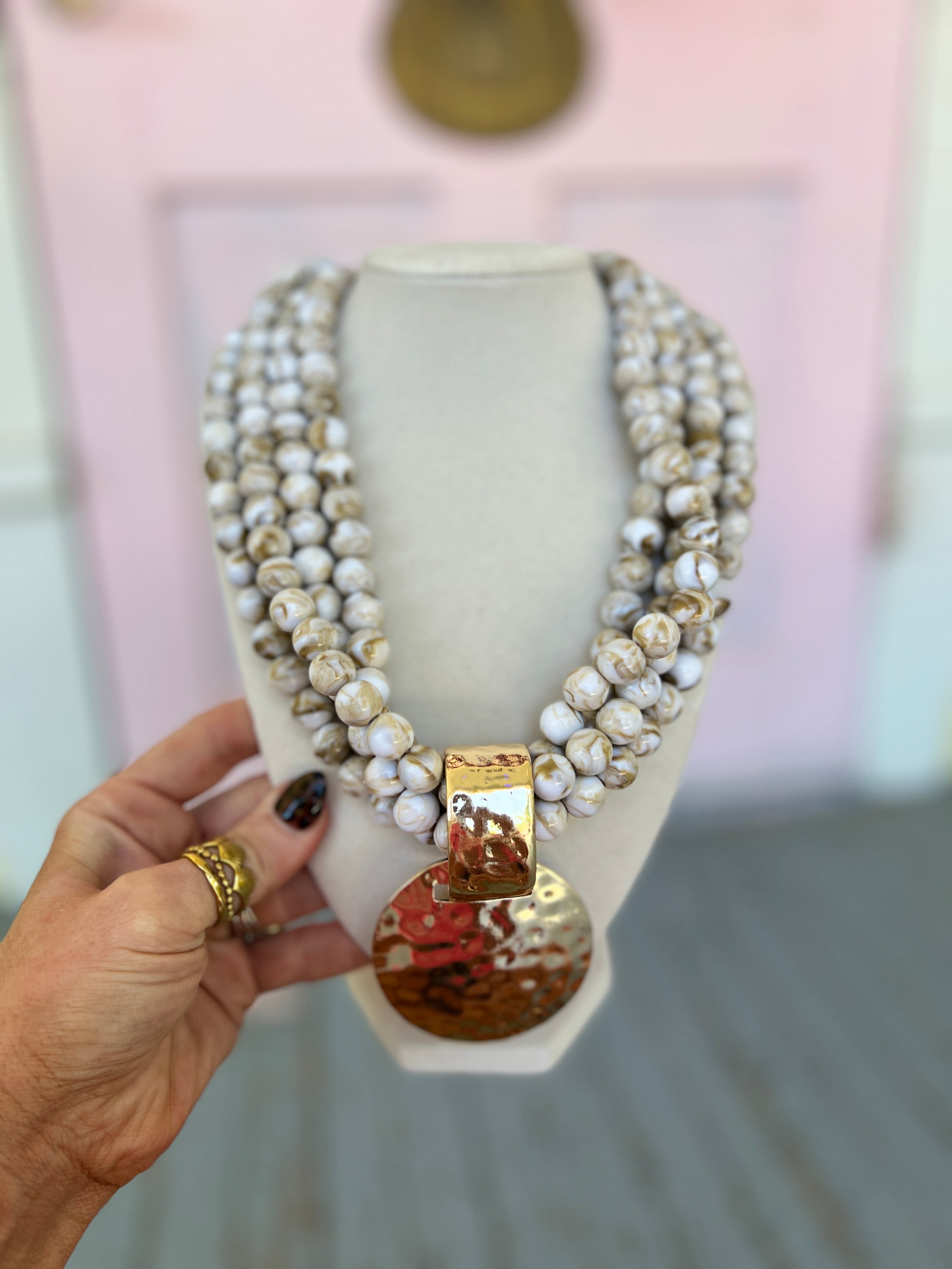 Hammered pendant bead necklace with ivory pearl-like beads and gold-toned pendant