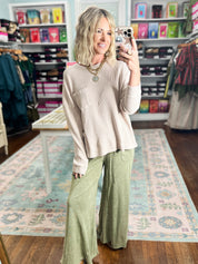Light taupe mineral-washed long-sleeve pullover top with chest pocket and relaxed fit