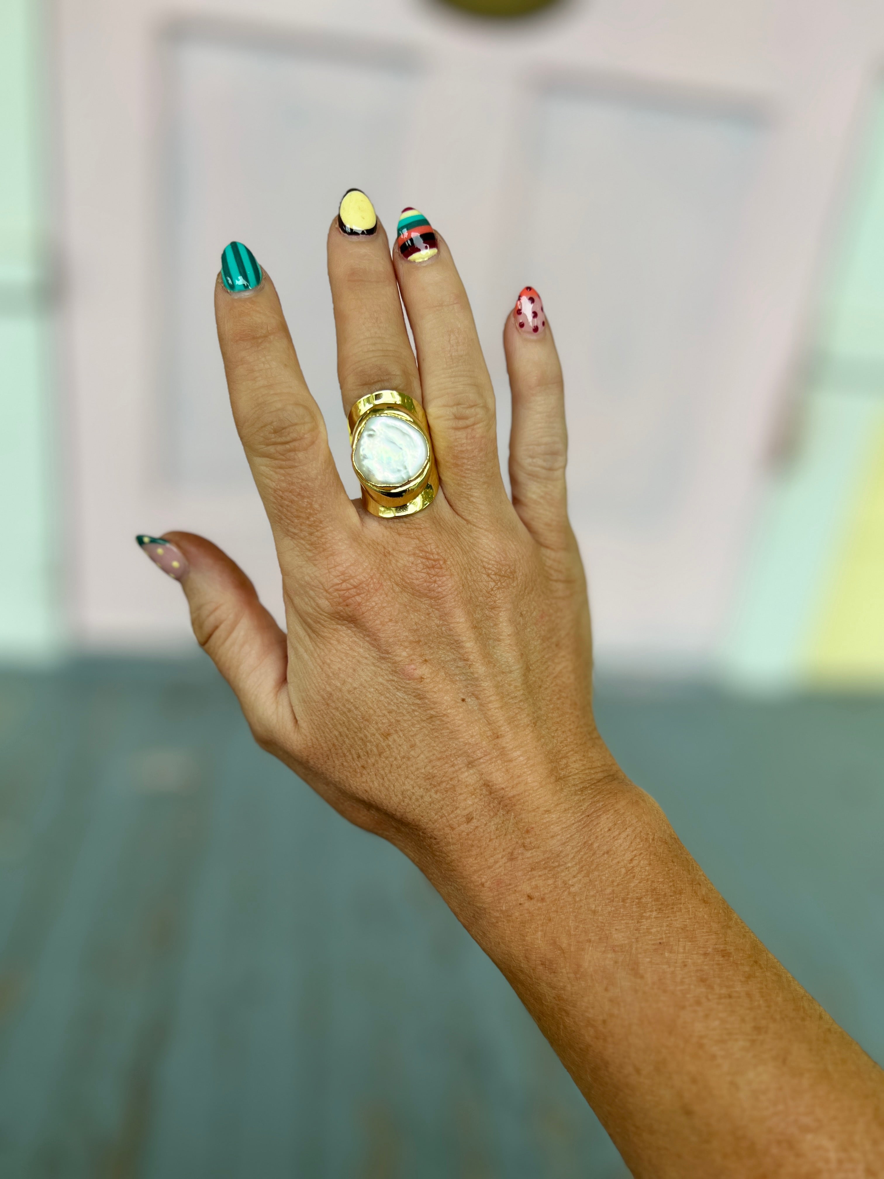 Gold-tone adjustable open ring with round freshwater pearl bezel
