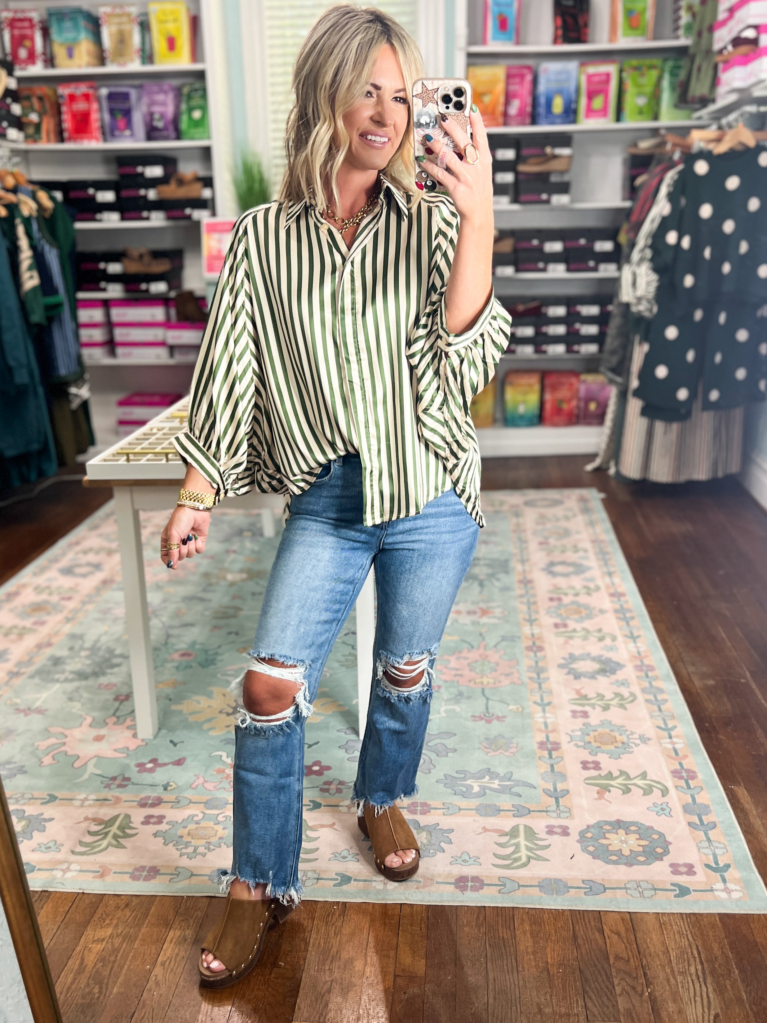 Olive vertical-striped button-down top with chest buttons and long sleeves