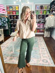 Light taupe puff-sleeve blouse with collared neckline and front zipper, full view