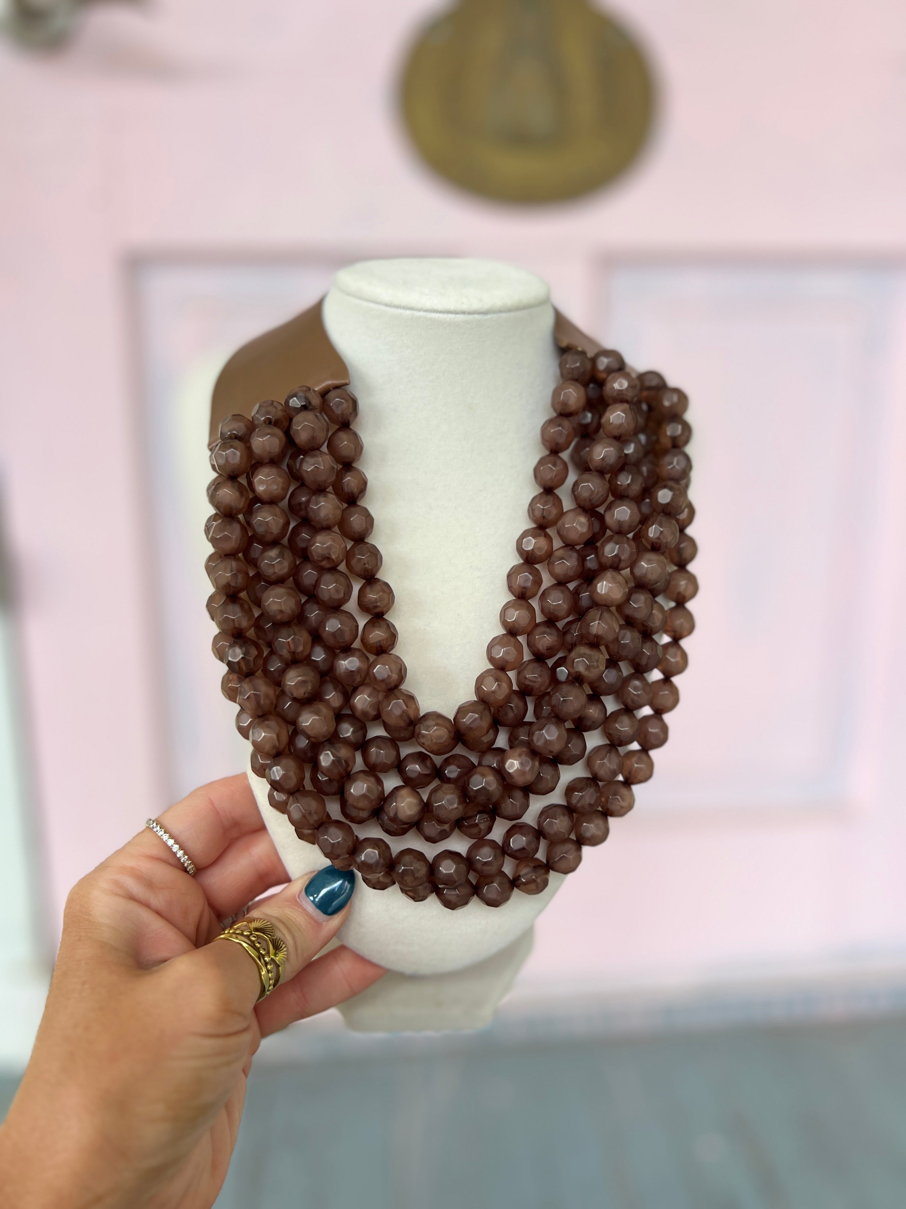 Dark brown faceted bead necklace with layered circular bead strands