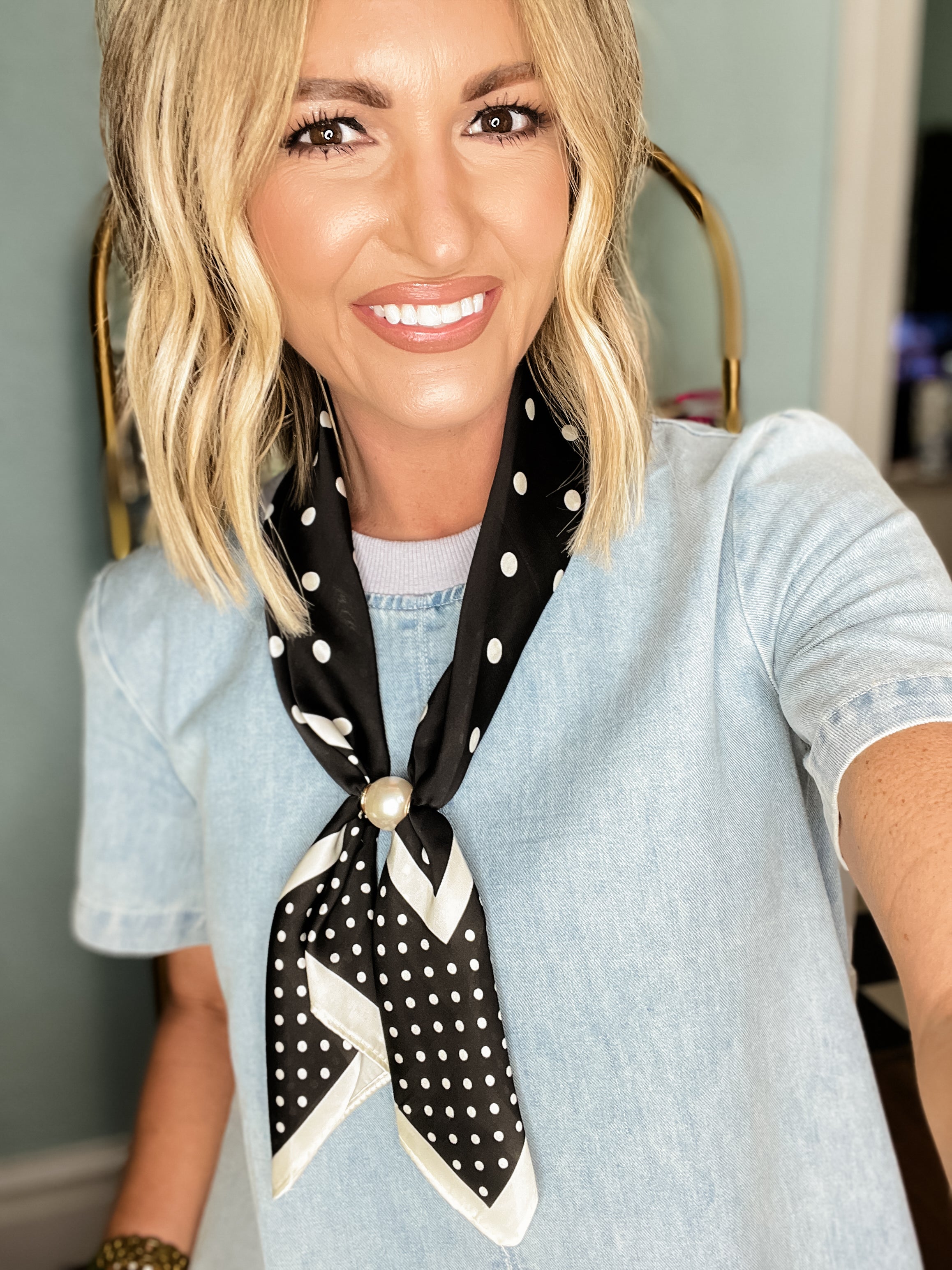 Pearl scarf necklace with black polka dot necktie and pearl detail at the knot