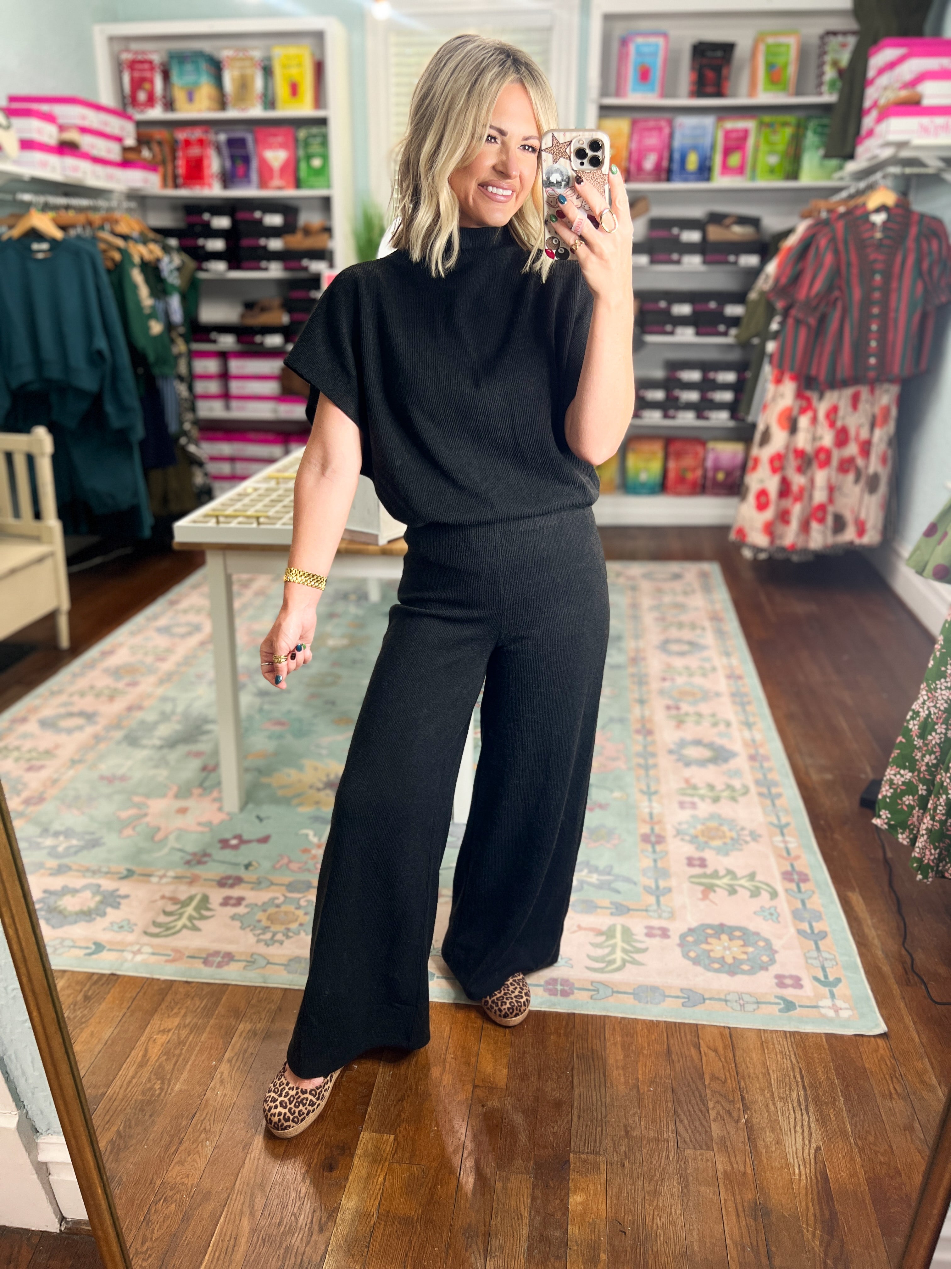 Black dolman-sleeve top and wide-leg pants set, loose fit with soft flowing fabric.