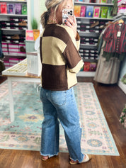 Color-block crew neck sweater in dark brown and cream, long sleeves (back/side)