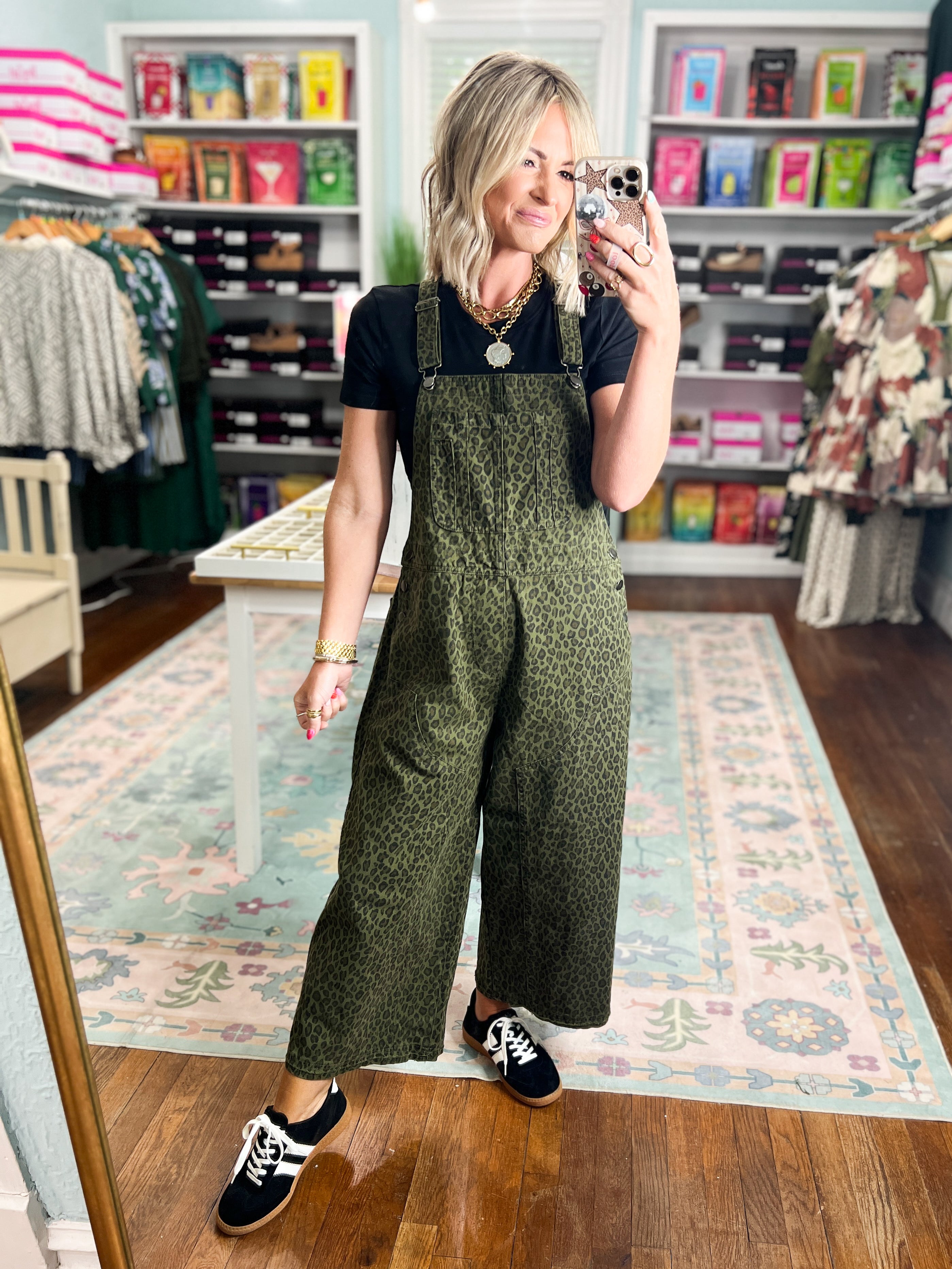 Olive patterned twill overalls with bib front and wide-leg pant silhouette