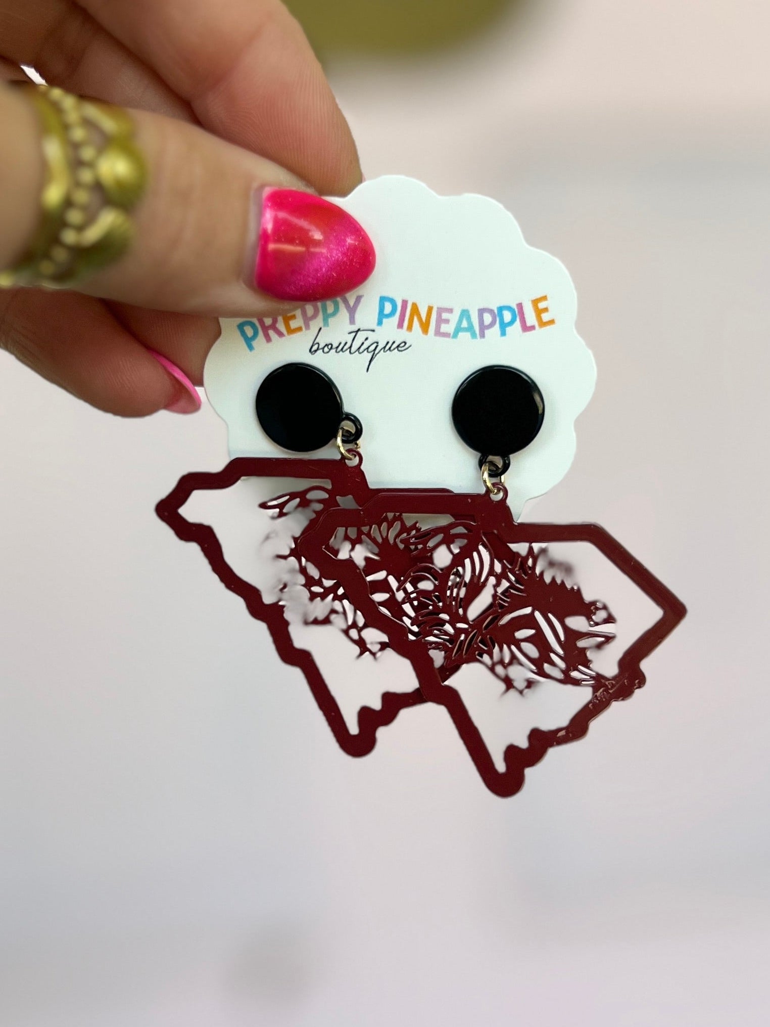 Burgundy filigree state map earrings with black circular studs