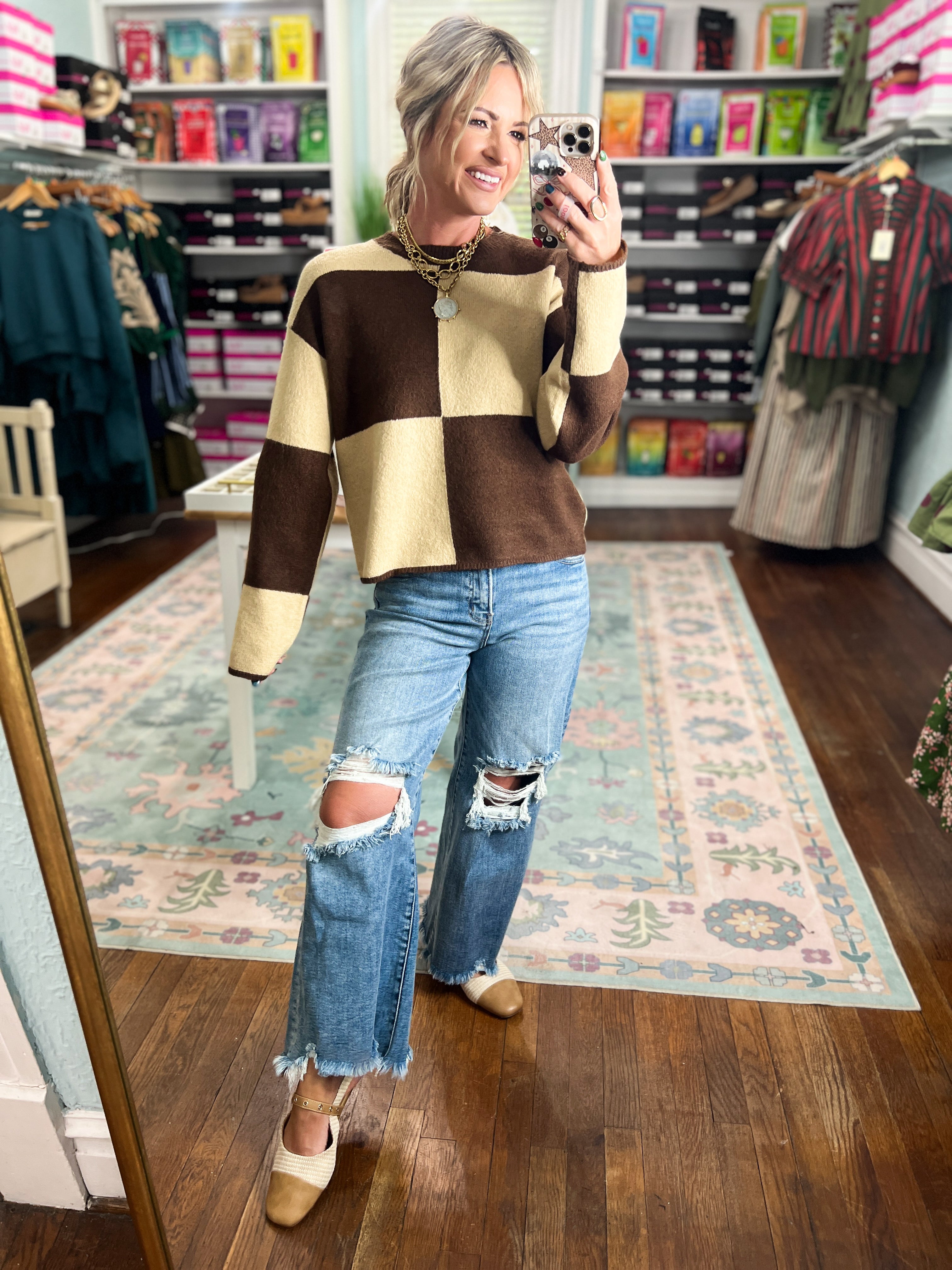 Color-block crew neck sweater in dark brown and cream, long sleeves (front view)