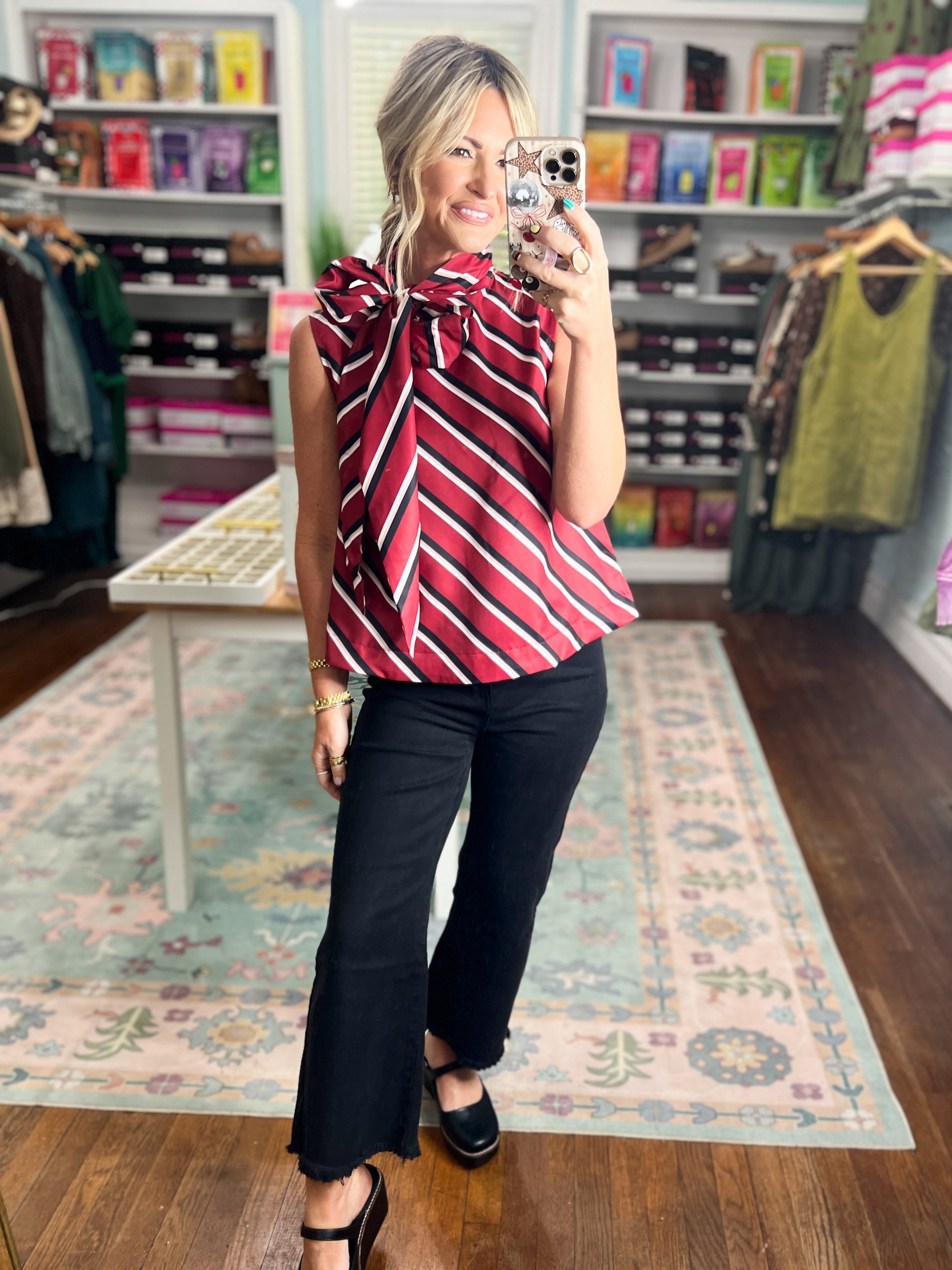 Burgundy striped sleeveless blouse with round neckline and relaxed fit