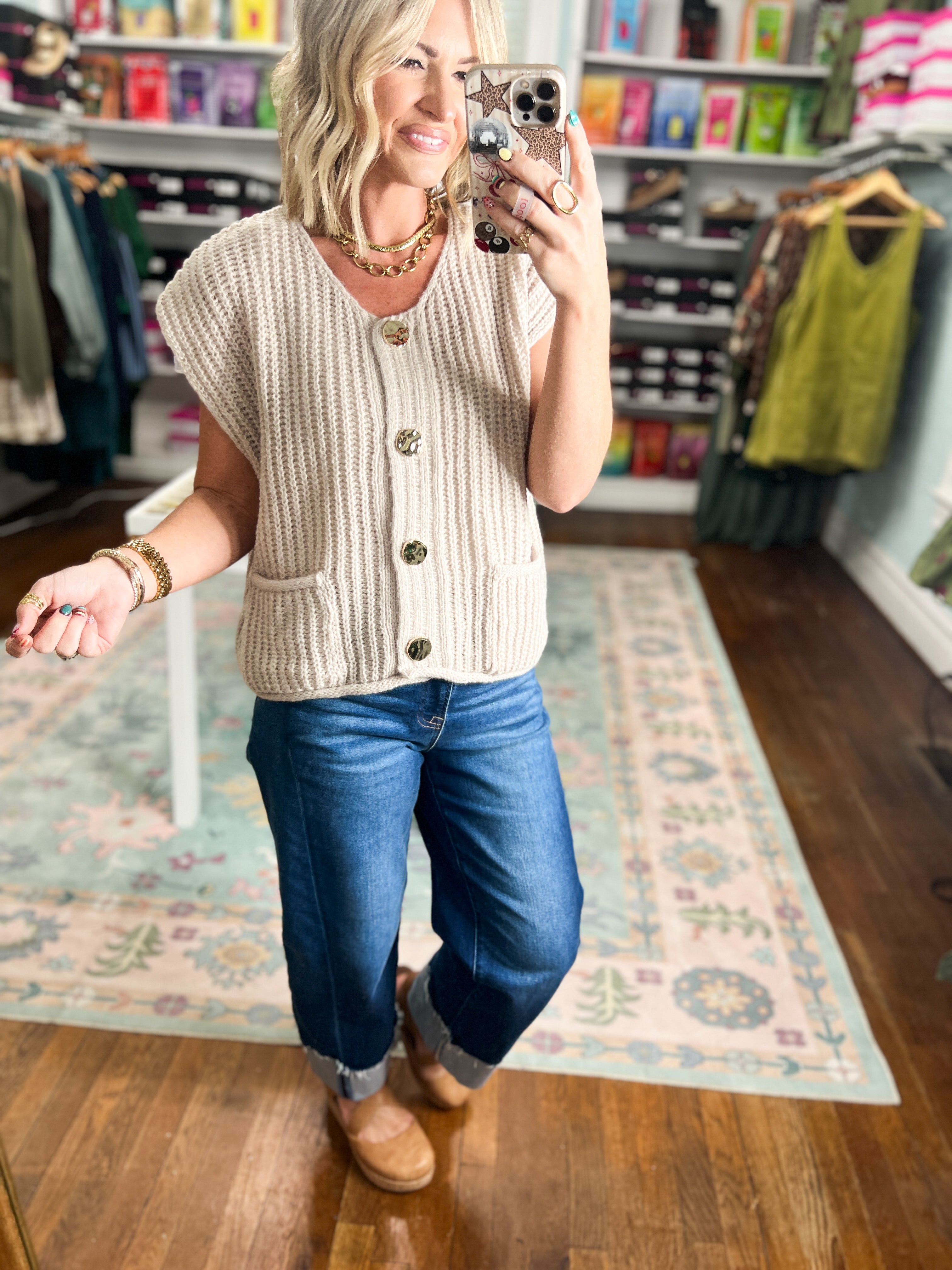 Beige knit sweater vest with button-front, ribbed hem, V-neck sleeveless