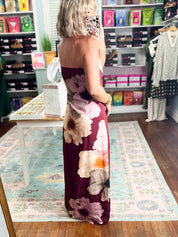Burgundy strapless maxi dress, back view with cream and pink floral print, fitted shape