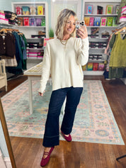 Cream roll-neck seam-detail sweater, front view with long sleeves