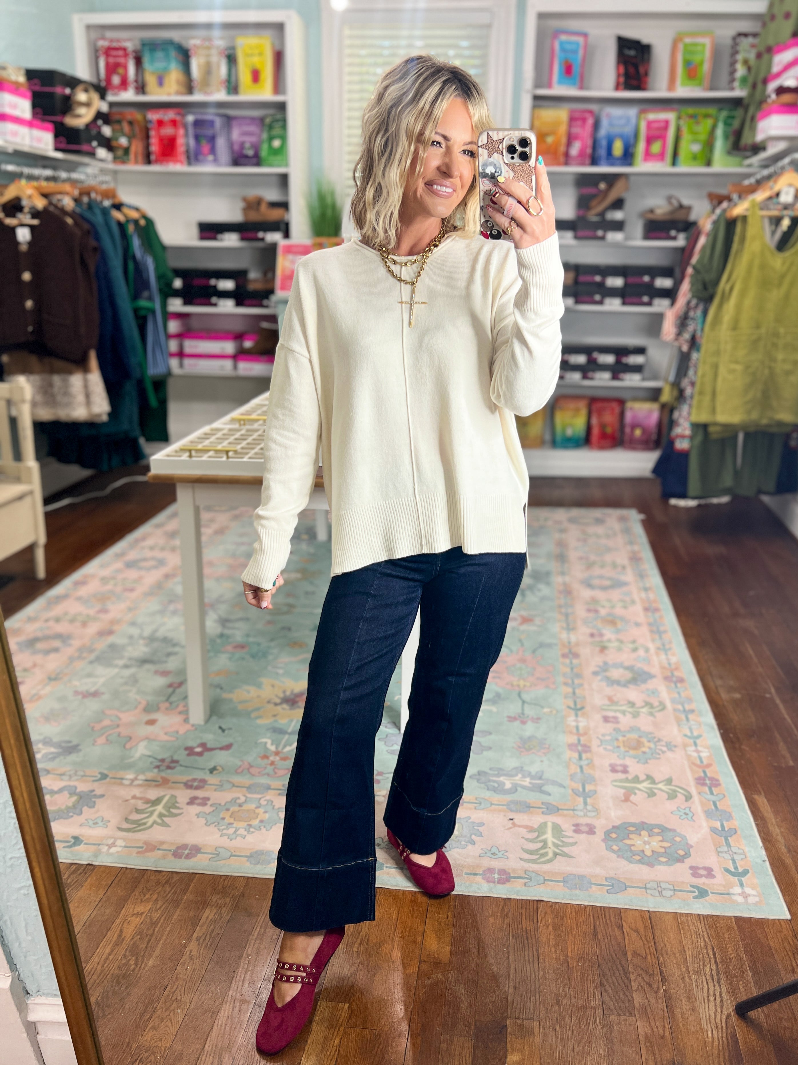 Cream roll-neck seam-detail sweater, front view with long sleeves