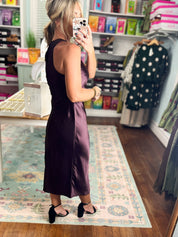 Dark cherry satin midi dress, sleeveless with open back and fitted mid-calf length.