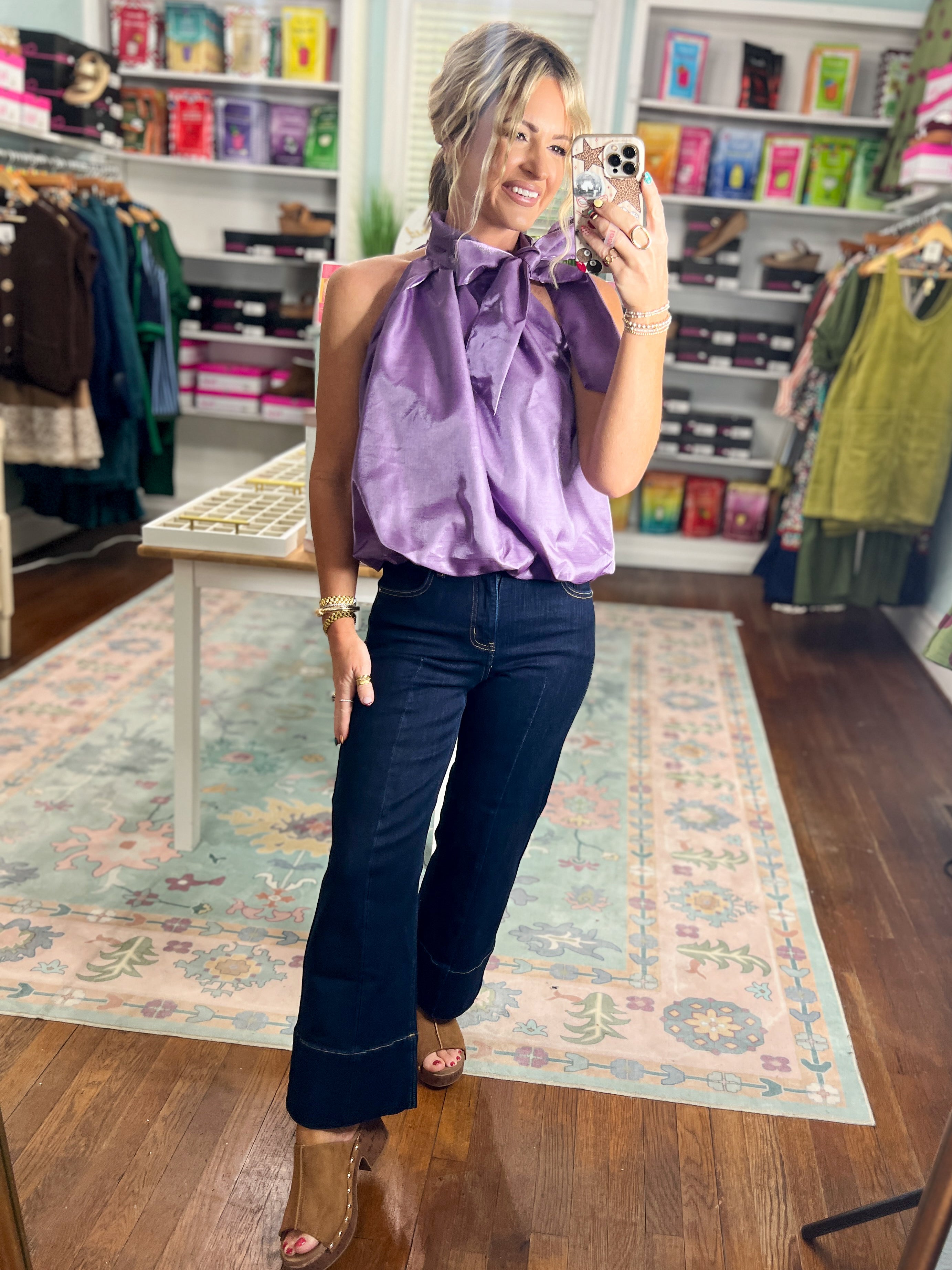 Purple sleeveless balloon top with ruffled high neckline and gathered front