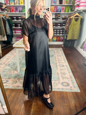 Black chiffon midi dress with short sleeves and flowing ruffle hem