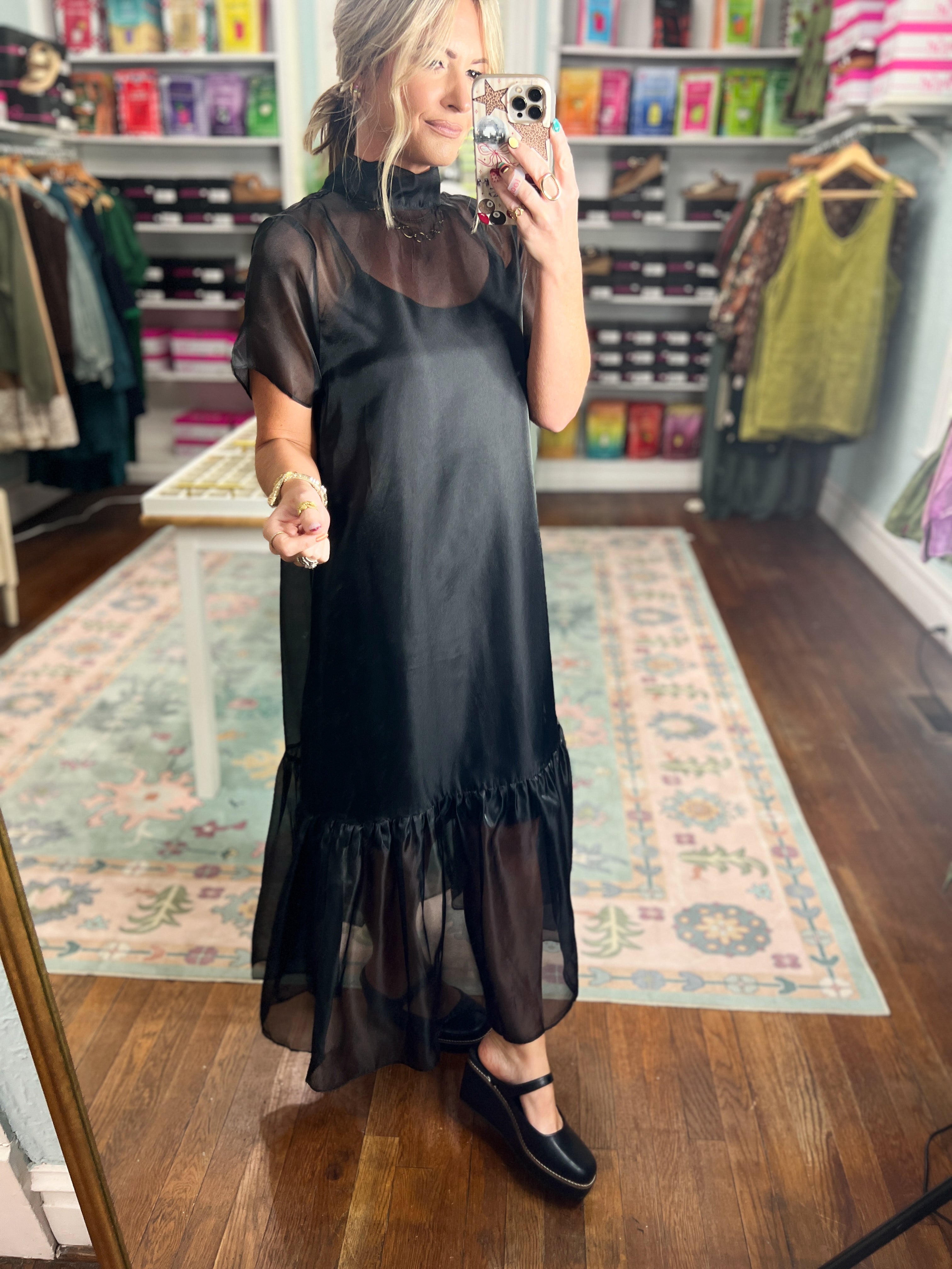Black chiffon midi dress with short sleeves and flowing ruffle hem