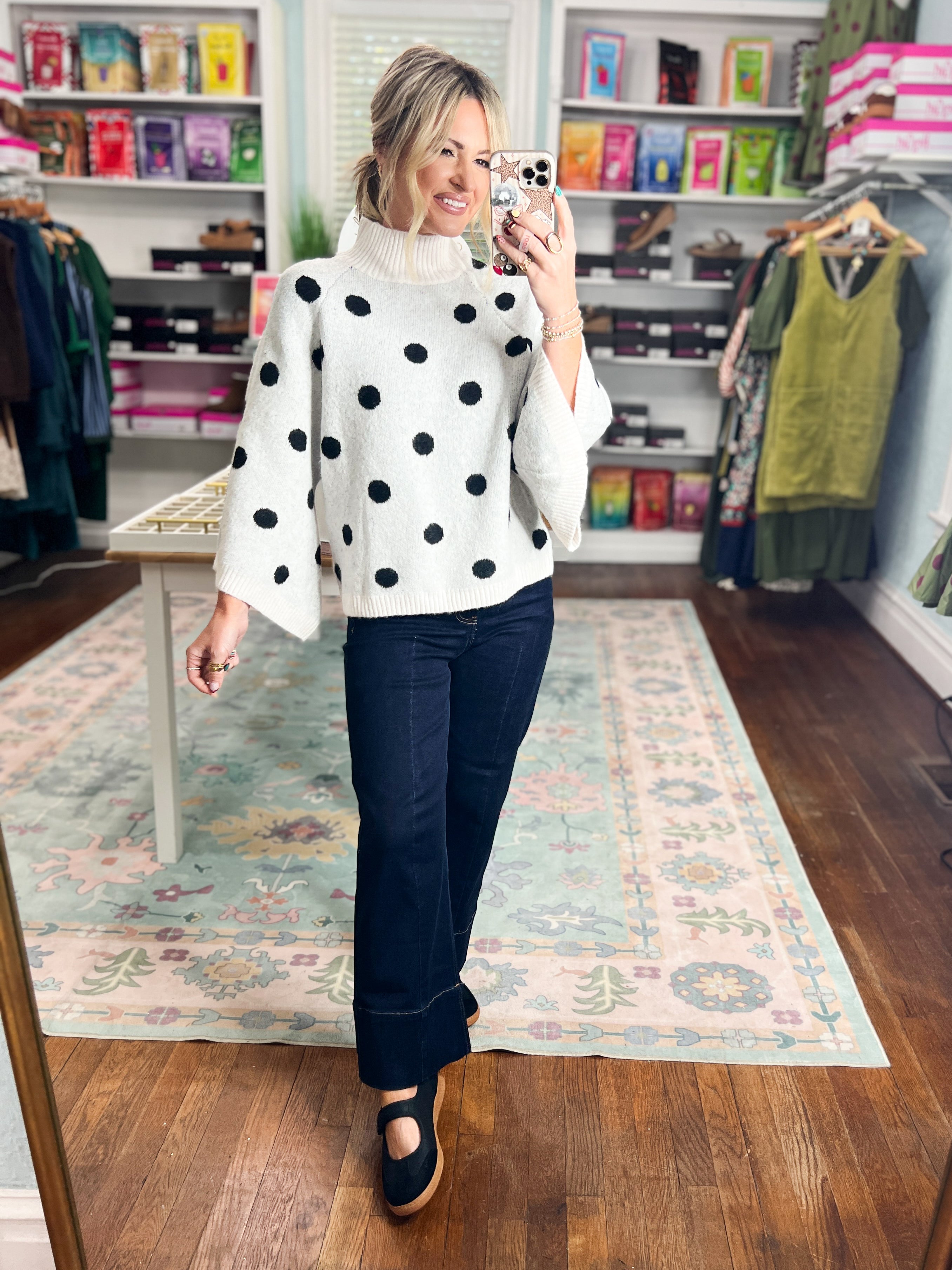 Cream knit sweater with black polka dots and ribbed turtleneck, long sleeves