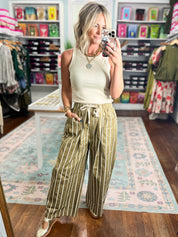 Wide pocket striped pants in olive green and white stripes, wide legs, tie waist