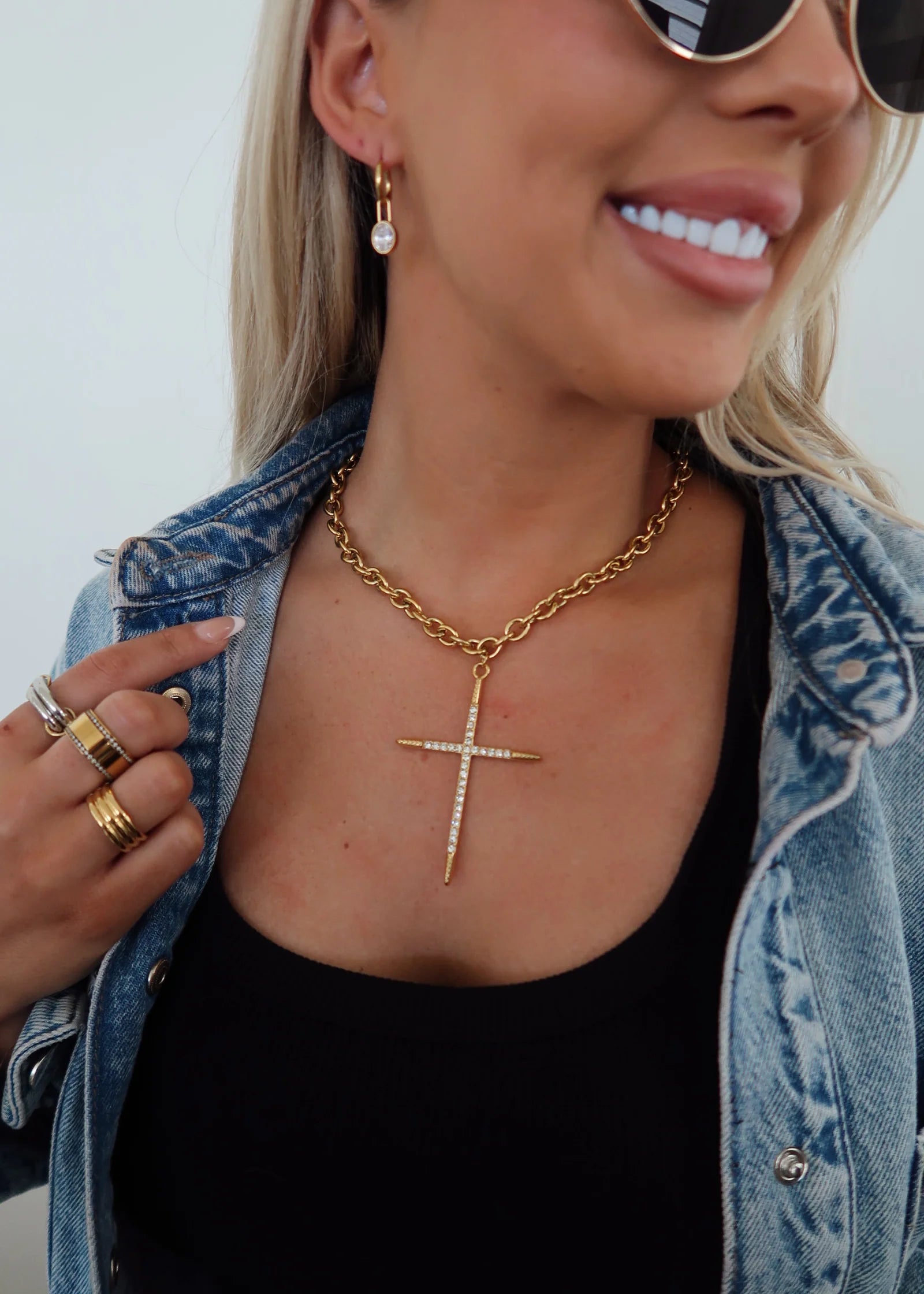 Gold cross pendant necklace on a fine chain