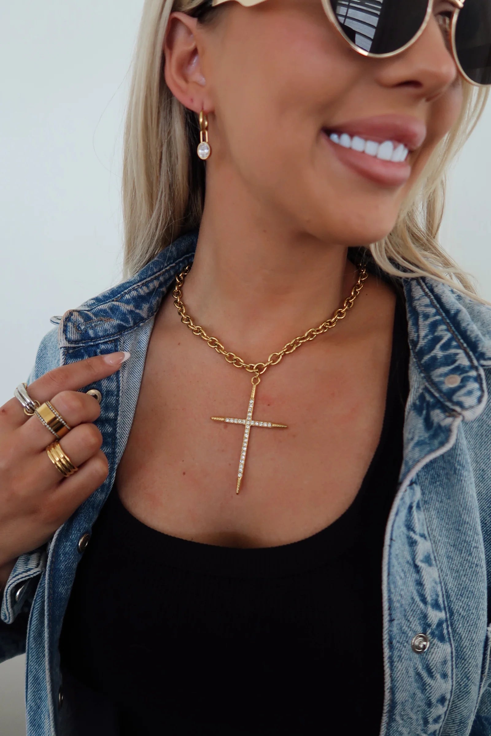 Gold cross pendant necklace on a fine chain
