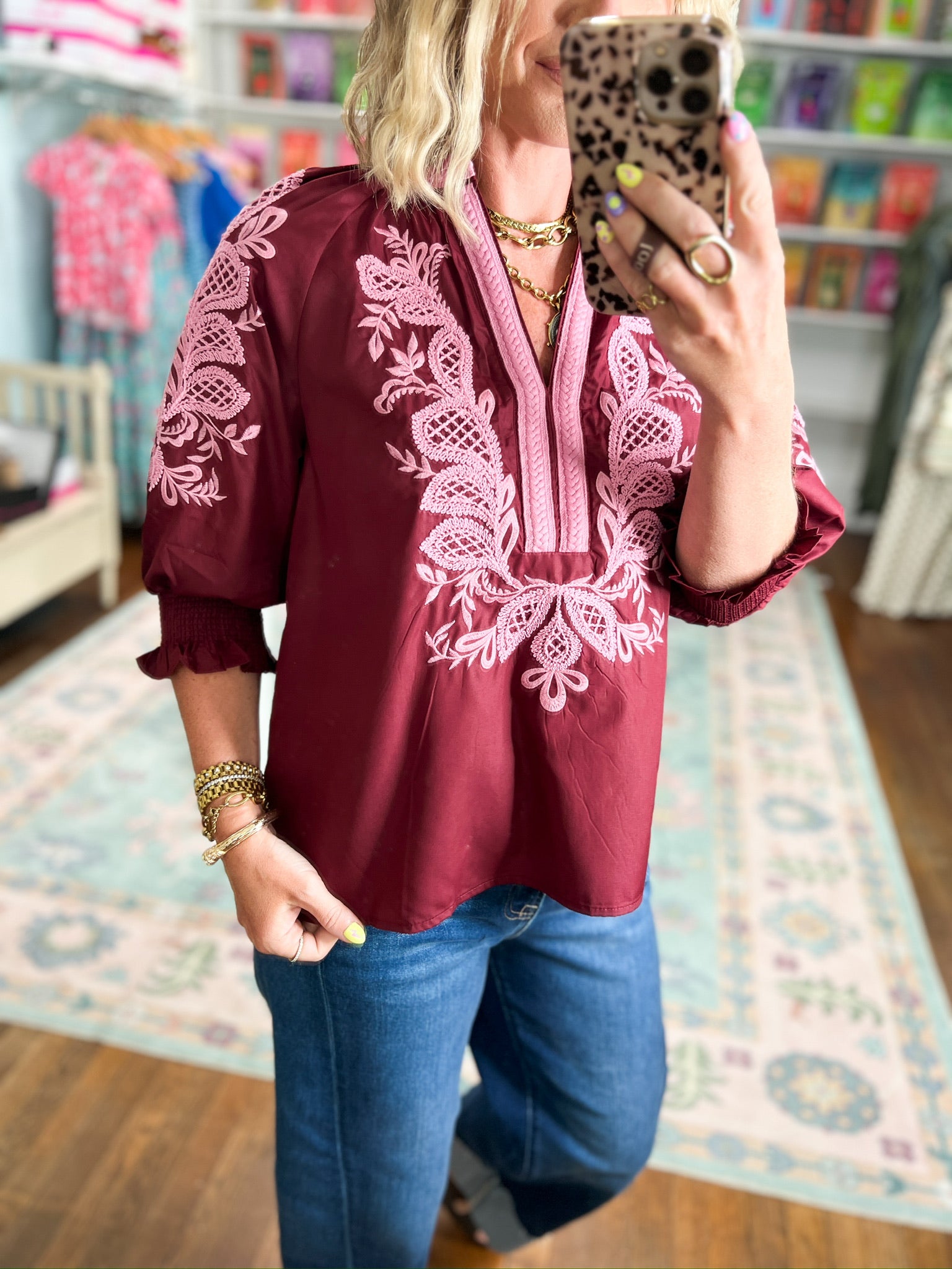 Burgundy embroidered tunic blouse with white thread pattern and V-neck