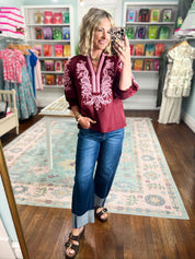 Burgundy embroidered blouse with billowed sleeves and keyhole front