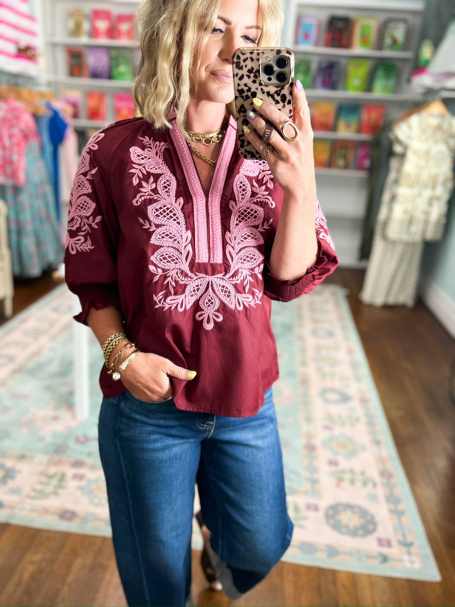 Burgundy embroidered peasant top with scalloped white trim and gathered neckline