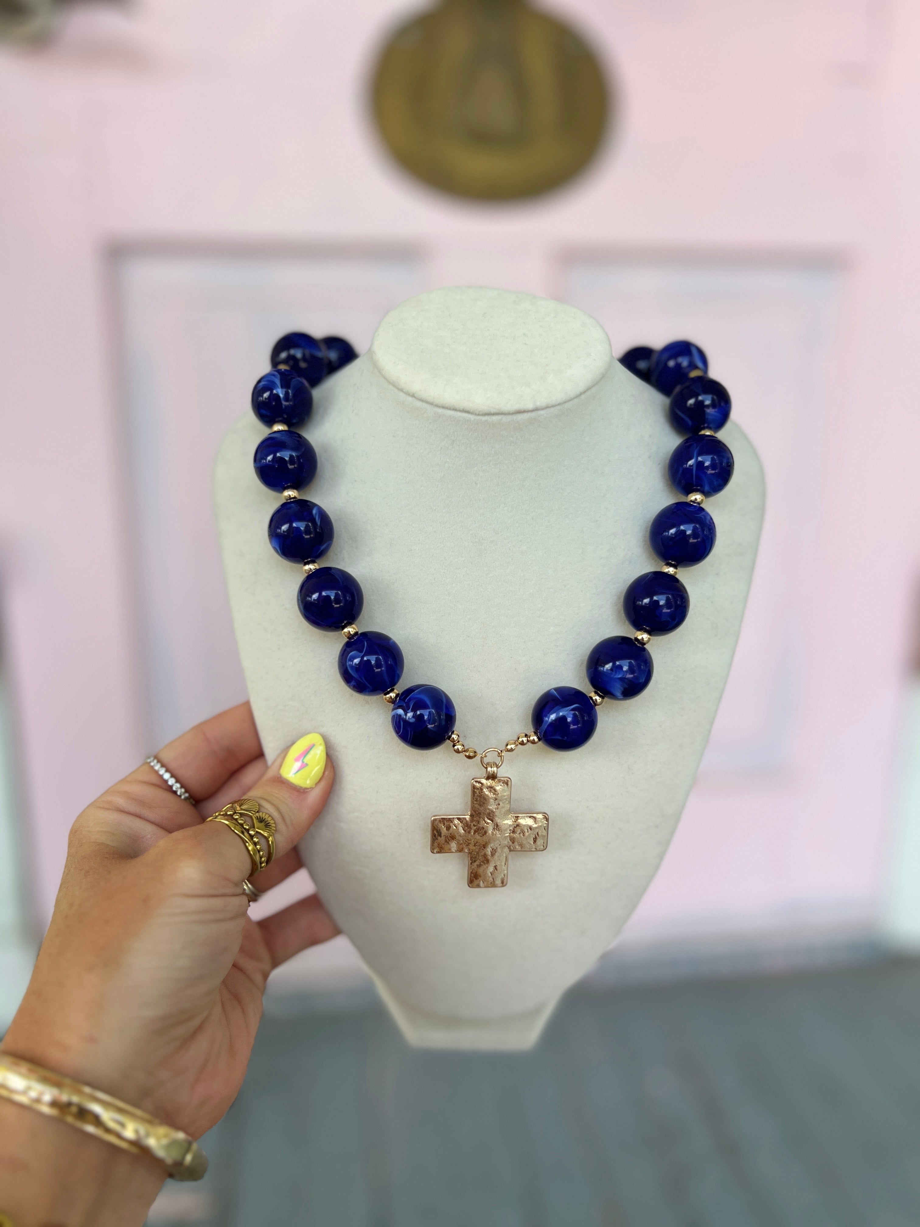 Royal blue beaded necklace with gold-tone cross charm