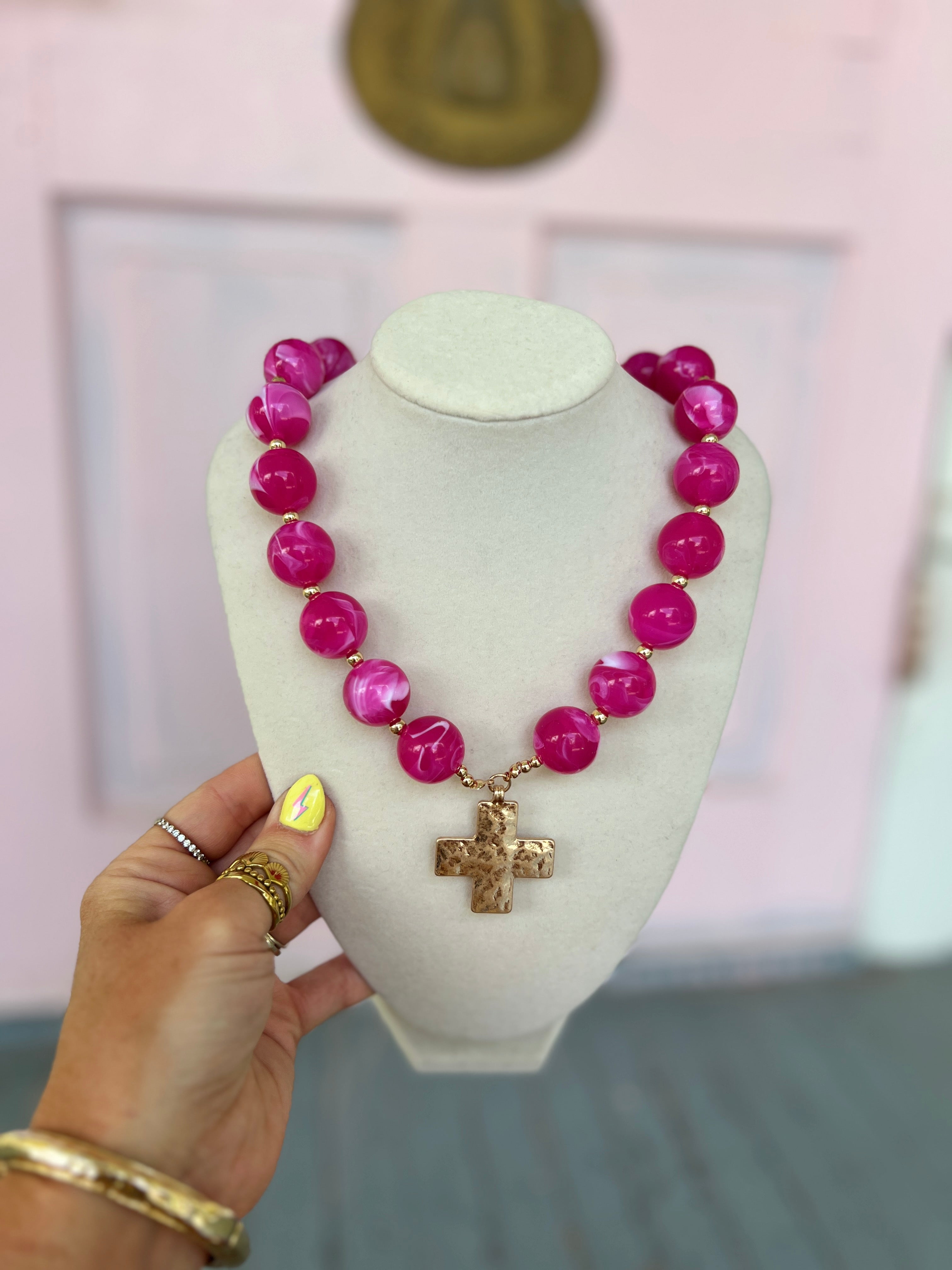 Fuchsia bead necklace with gold-tone cross charm pendant