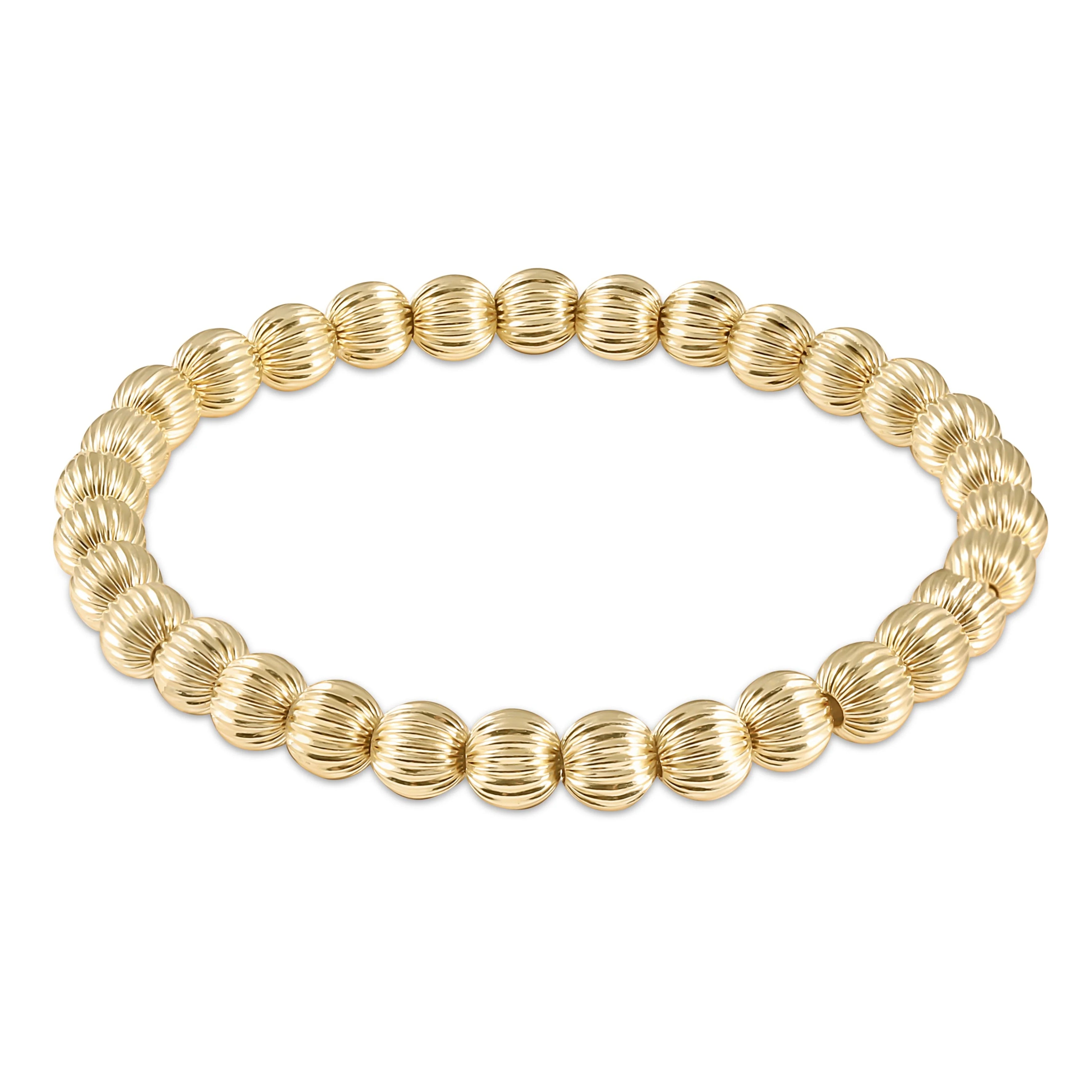 Gold 6mm bead bracelet with ribbed round segments, flexible link design