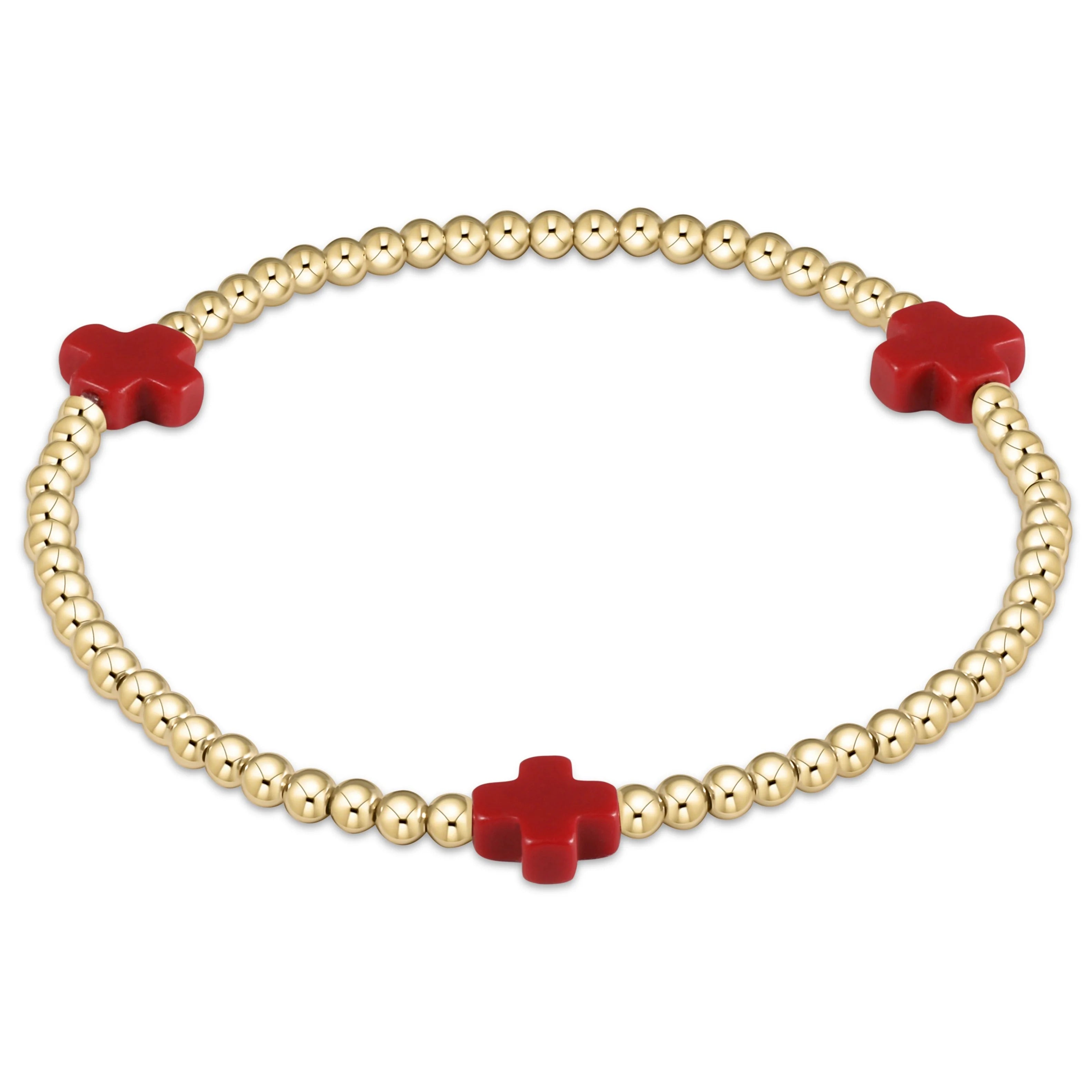 Gold beaded bracelet with three red cross charms