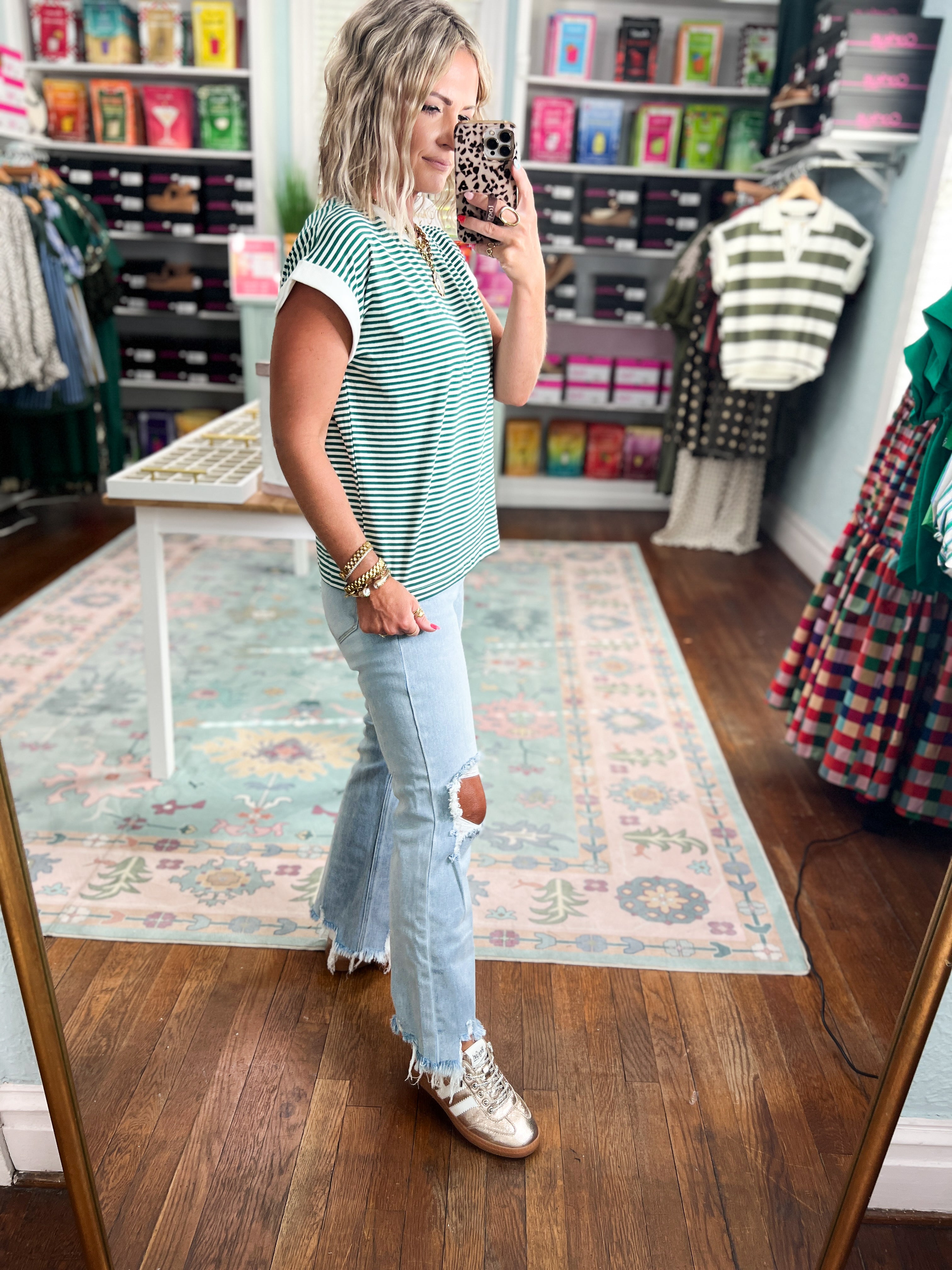 Hunter green and white striped short-sleeve crew-neck top, side view